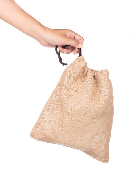 рука тримає сумку Стікер ізольовано на білому тлі
. - Фото, зображення