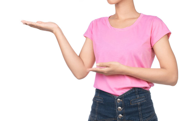 woman wearing blank pink t-shirt, jeans present the project isolated on white background - Foto, imagen