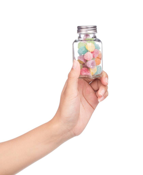 mano bottiglia di gelatine colorate isolato su sfondo bianco
 - Foto, immagini