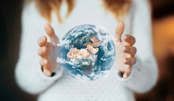 Man holding a glowing earth globe in his hands. 3d rendering - Photo, Image