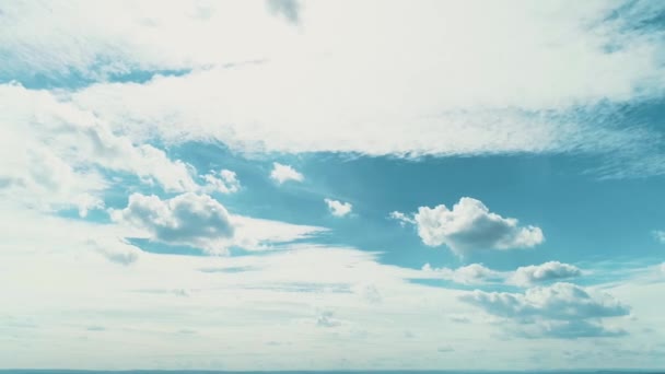 Beautiful clear blue sky with moving white puffy clouds on sunny weather. - Materiał filmowy, wideo