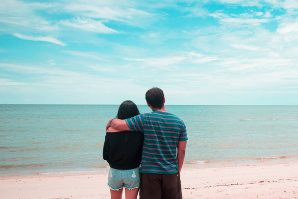 Couple lover neck and looking to the sea. look to the future concept. Travel concept. Relax and holiday concept. Copy space. - Photo, image