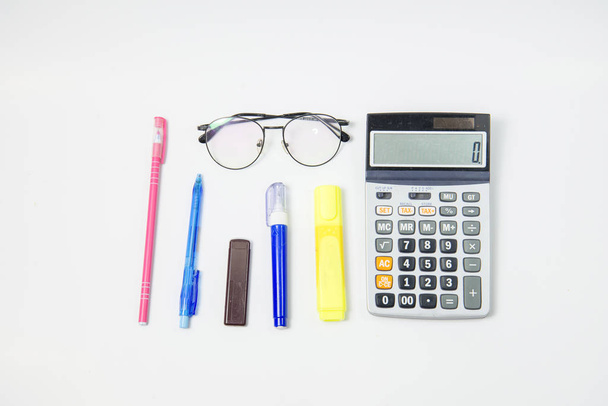 Set of Stationery office equipment or study as Glasses Marker, pens, and liquid on white background. Back to school concept. work and write concept. think business. copy space. text message. - Photo, Image