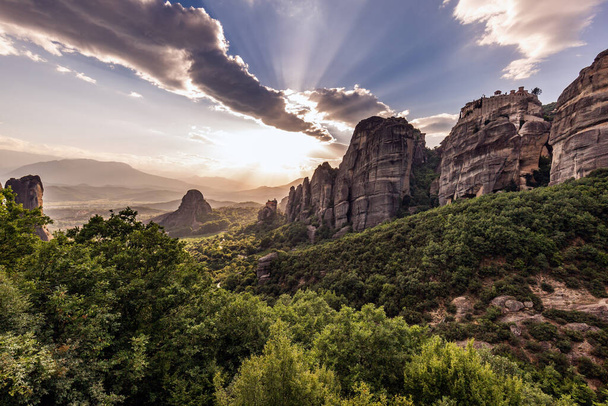 Monastery Meteora Greece. Stunning summer panoramic landscape. View at mountains and green forest against epic blue sky with clouds. UNESCO heritage list object. - Photo, image