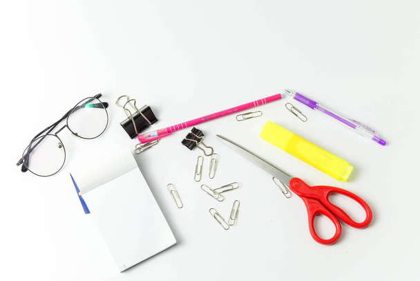 Set of Stationery office equipment or equipment study as Glasses, pen, liquid, marker, clipboard and scissors on white background. Back to school concept. task work. hard or busy job concept. - Fotografie, Obrázek