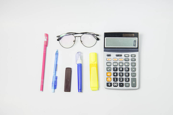 Set of Stationery office equipment or equipment study as Glasses, pen, liquid, marker, clipboard and scissors on white background. Back to school concept. task work. hard or busy job concept. - Photo, Image