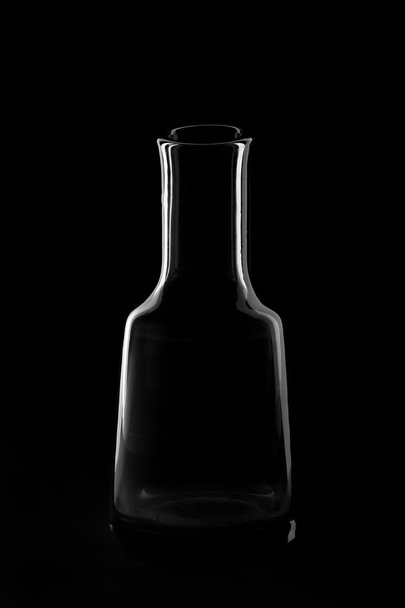 silhouette of the bottle on a black background - Photo, Image