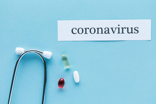 Coronavirus 2019 n-Cov concept. Medicines for Coronavirus and tablet on color background - Photo, image