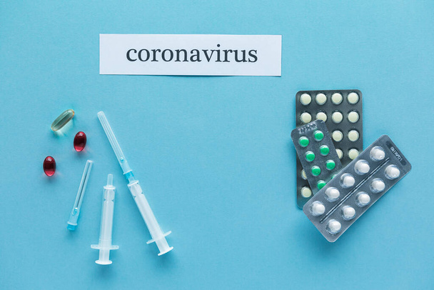 Coronavirus 2019 n-Cov concept. Medicines for Coronavirus and tablet on color background - Photo, image
