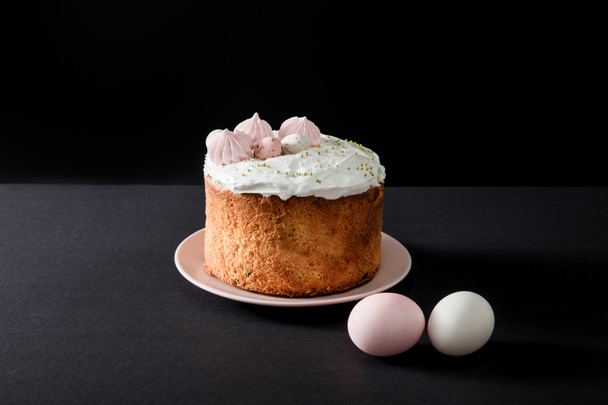 Easter cake and chicken eggs on grey and black - Fotó, kép