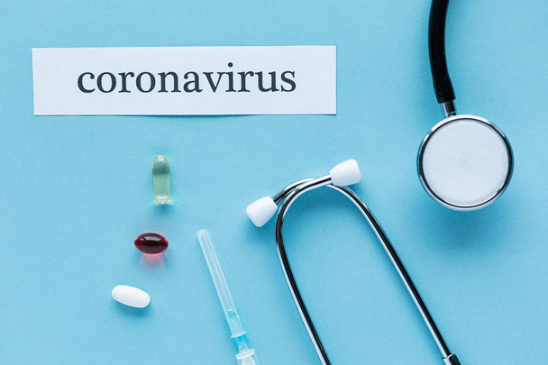 Coronavirus 2019 n-Cov concept. Medicines for Coronavirus and tablet on color background - Φωτογραφία, εικόνα