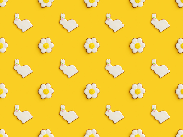 Flat lay with tasty easter cookies isolated on yellow background, seamless pattern - Фото, изображение
