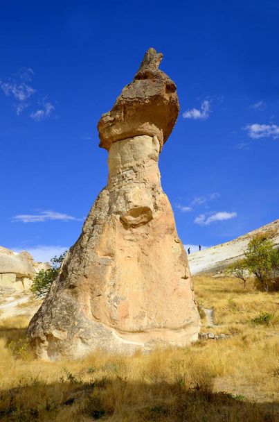 Probably the best known feature of Cappadocia, Turkey found in its very heart, are the fairy chimneys of Goreme and its surrounding villages - Foto, Imagen