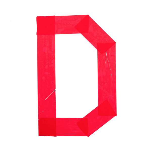 Brief "D" gemaakt van rood plakband. Geïsoleerd op witte achtergrond - Foto, afbeelding