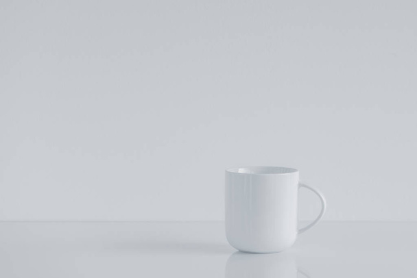 White teacup mock up with bright white copy space - Fotó, kép