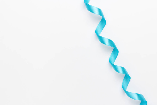 A light blue ribbon on a white background - Фото, изображение