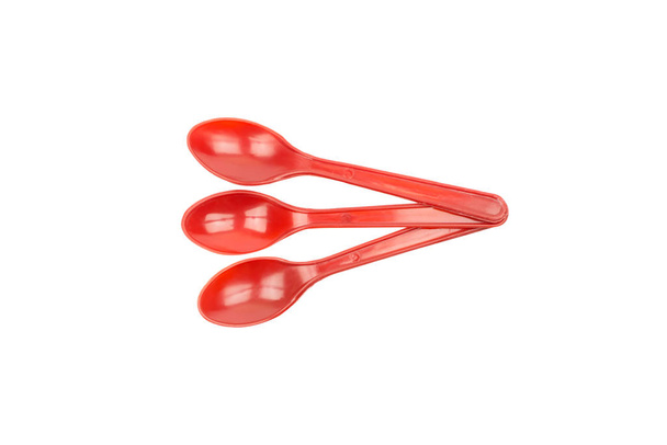 Red plastic spoon isolated on white background - Photo, Image