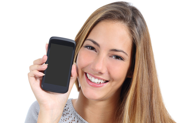 Cute girl showing a blank smart phone screen isolated - Foto, imagen