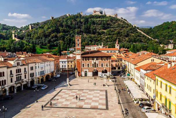 Marostica, Italy - Oktober, 01, 2017: View of the old building, chess square and castle on the mountain. - Fotó, kép