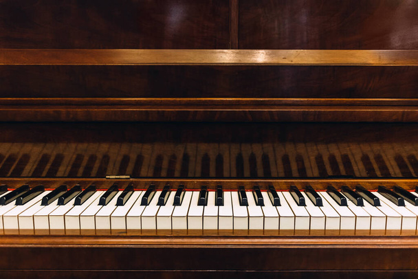 Vintage wooden piano in close-up shot, Music instrument equipment and Entermainment concept - Photo, Image