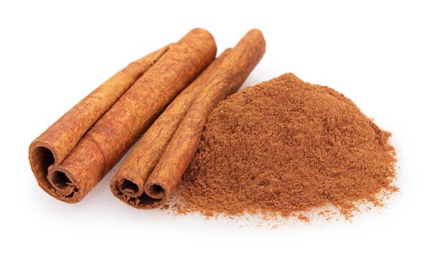 cinnamon stick with powder isolated on white background closeup - Photo, Image