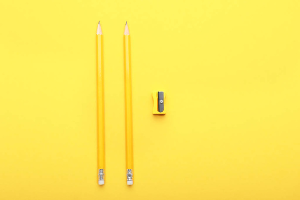 Ordinary pencils and sharpener on color background - Photo, Image