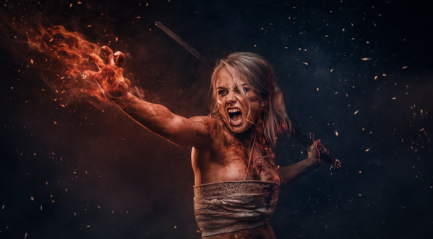 Naked Fantasy woman warrior wearing rag cloth stained with blood and mud in the heat of battle. Cosplayer as Ciri from The Witcher - Φωτογραφία, εικόνα