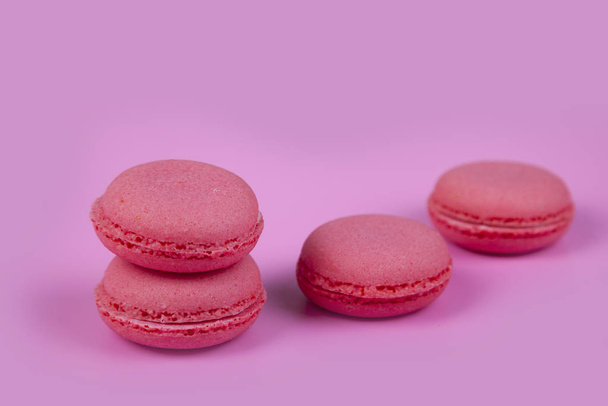 Macaroons on a pink background. Tasty dessert. - Photo, Image