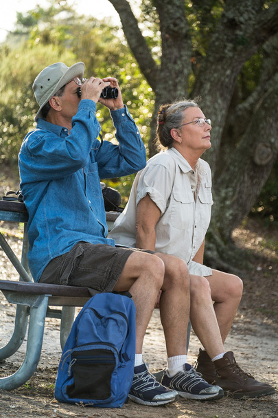 Senior Couple Hiking, Birdwatching and Camping - Foto, afbeelding
