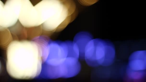 Out of focus of people in a street at night. Blurred. Not clear. Shallow DOF. - Footage, Video