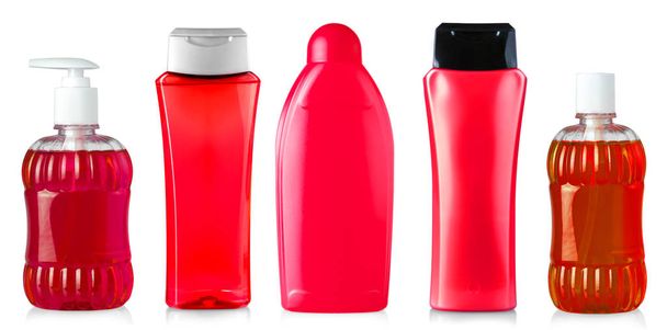 Τα κόκκινα μπουκάλια τζελ ντους απομονώνονται σε λευκό φόντο - Φωτογραφία, εικόνα