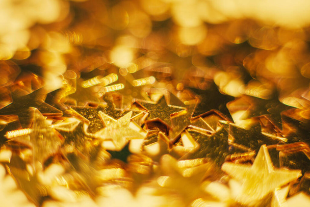 Brillo brillo, confeti estrellas oro negro patrón festivo fondo
 - Foto, Imagen