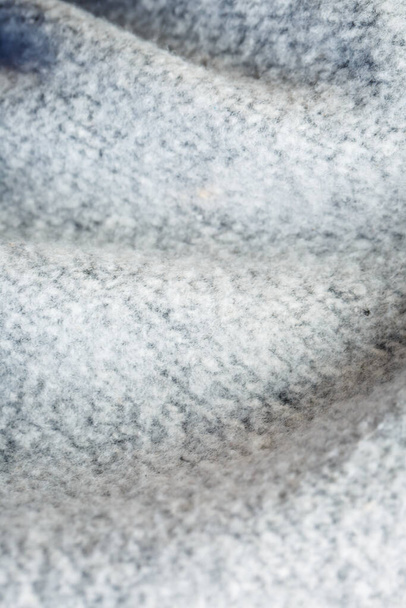 Textur weißer Wolle auf Kleidung zum Erwärmen in Makroansicht - Foto, Bild
