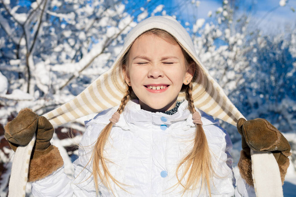 Cute little girl playing  on winter snow day. Concept of Happy new year. - Fotó, kép
