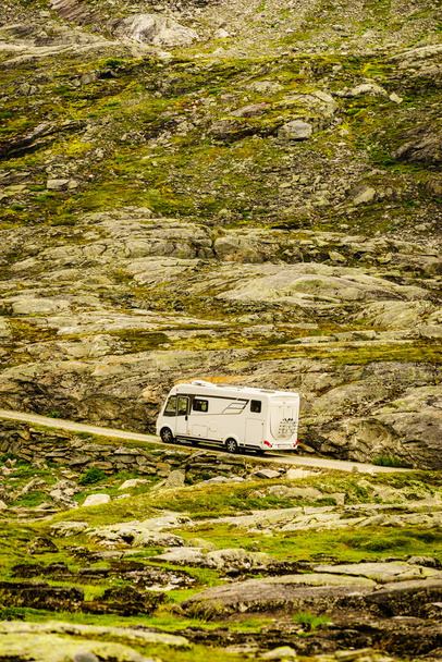 Camper in norwegian mountains. Camping on nature. Traveling, holidays and adventure concept. - Photo, image