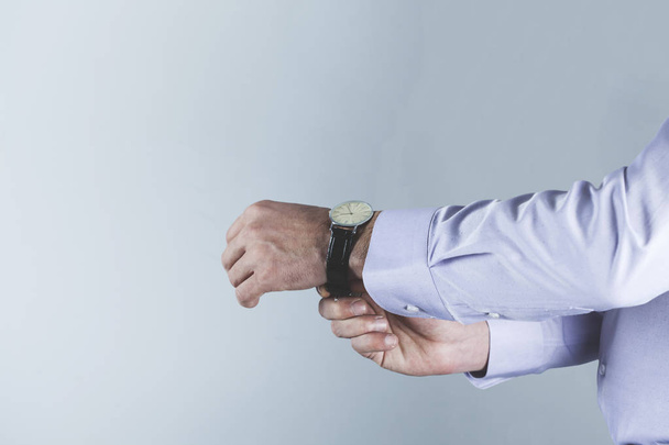 man hand watch on the gray background - Photo, image