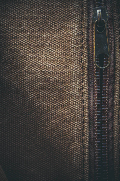 Thick khaki fabric and zipper on it in macro - Photo, Image