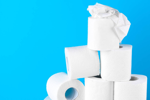 Toilet paper. Close up shot on blue background - Foto, afbeelding