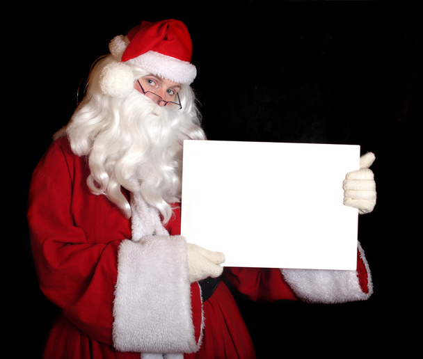 Santa showing paper - Photo, Image