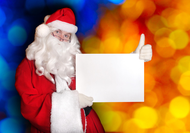 Santa showing paper and  thumb up - Photo, Image