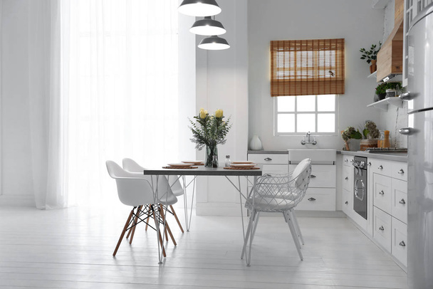 Beautiful kitchen interior with new stylish furniture - Fotó, kép