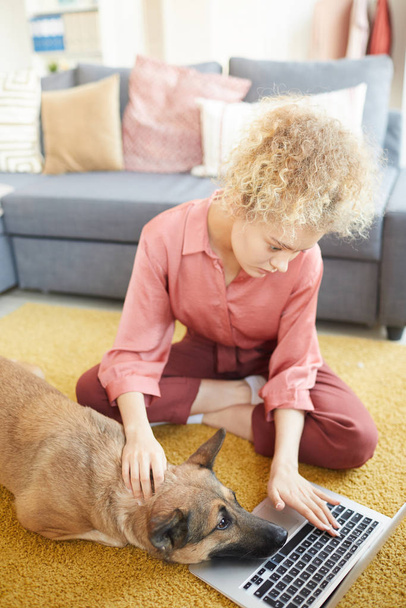 Woman and her pet at home - Photo, Image
