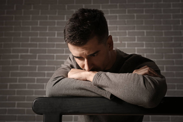 Portrait of depressed young man indoors - Foto, Imagem