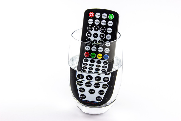 Waterproof TV remote control in a glass of water - Photo, Image