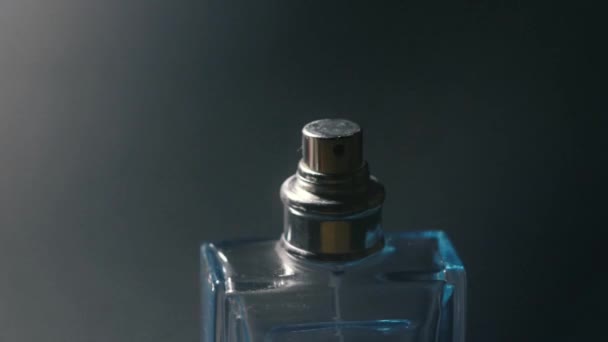 Glass perfumes bottle on black background - Footage, Video