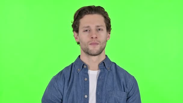 Thumbs Down by Disappointed Young Man on Green Chroma Key - Footage, Video