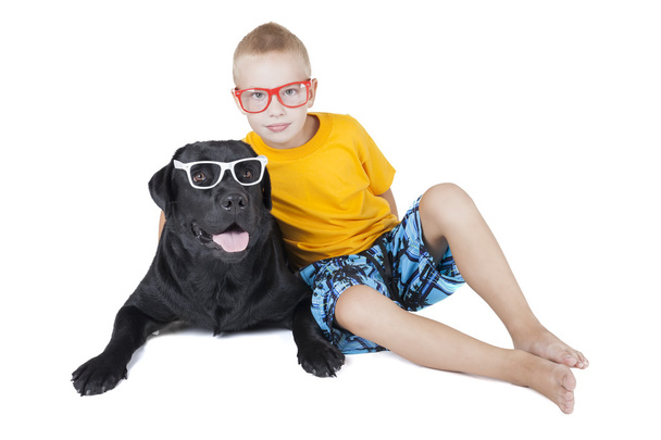 Boy with a dog with glasses - Foto, Imagen