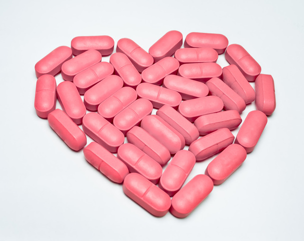 heart shaped pill - Foto, immagini