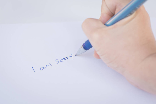 Kağıt ve kalem bir kısa mesaj ile özür dile - Fotoğraf, Görsel