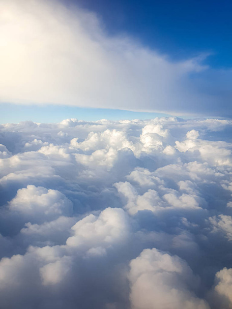 Vertical image of looking above the beautiful clouds in the sky - Photo, Image